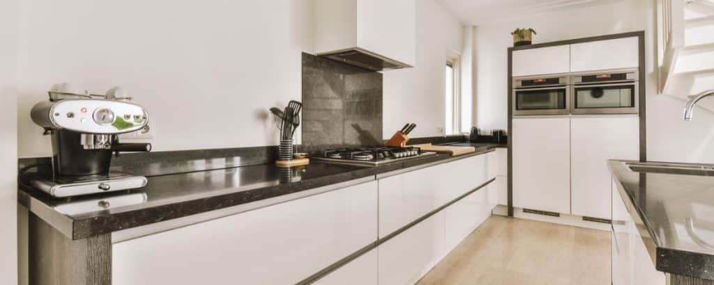 Stock kitchen cabinets supporting quartz countertops in Tampa home